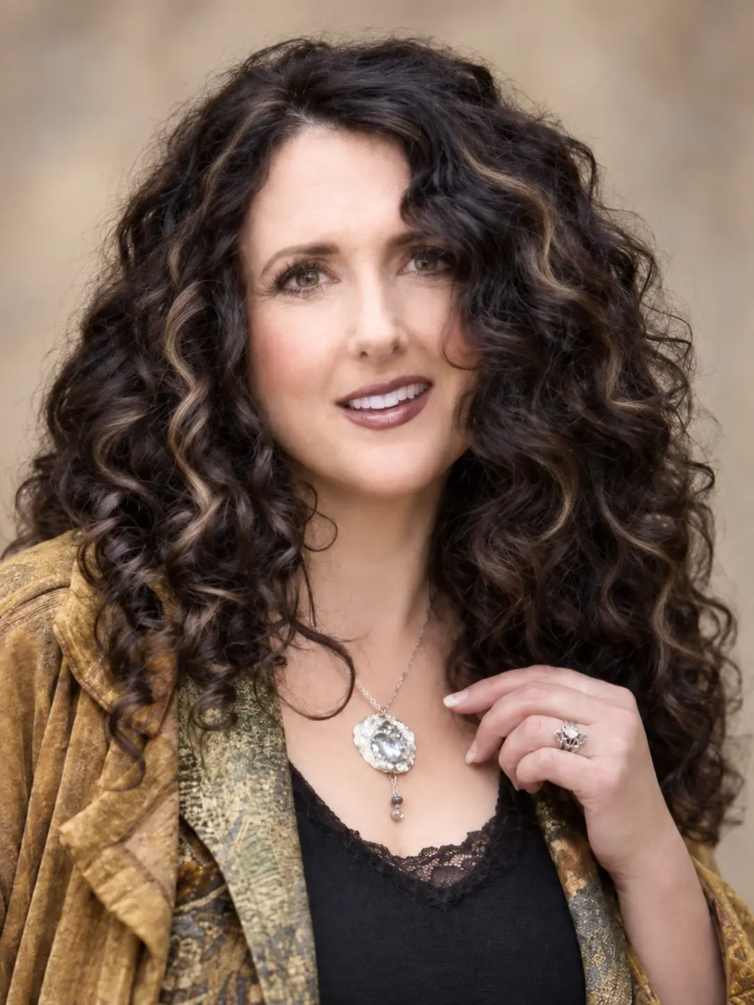 Jewelry artist and songwriter Cilette Swann wearing one of her fine silver designs
